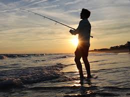 Man fishing on a beach